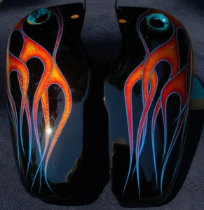 Metal flake flames with candy red, orange and yellow fades, pinstriped with blue. Our Customer Tony was very happy with these.